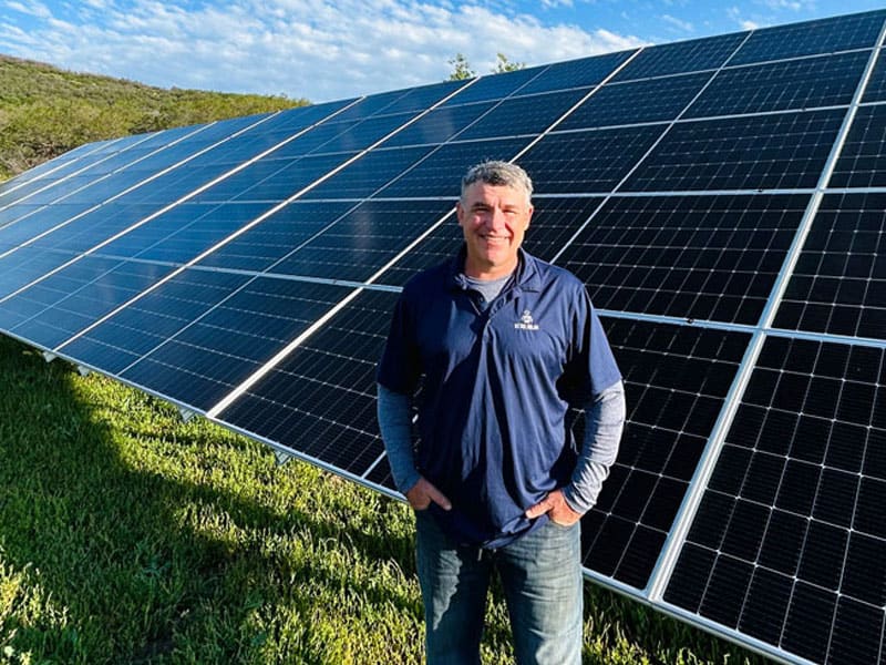 Detail Solar technician handling a solar panel during a reset
