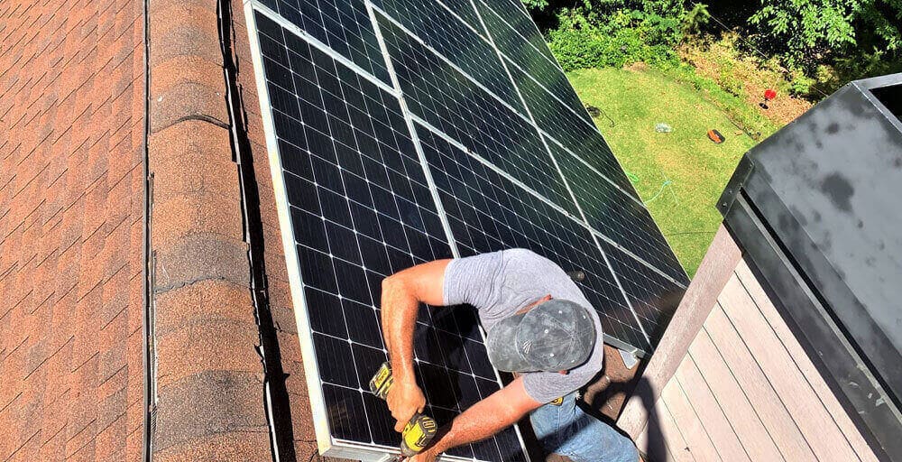 Detail Solar crew performing a solar panel installation