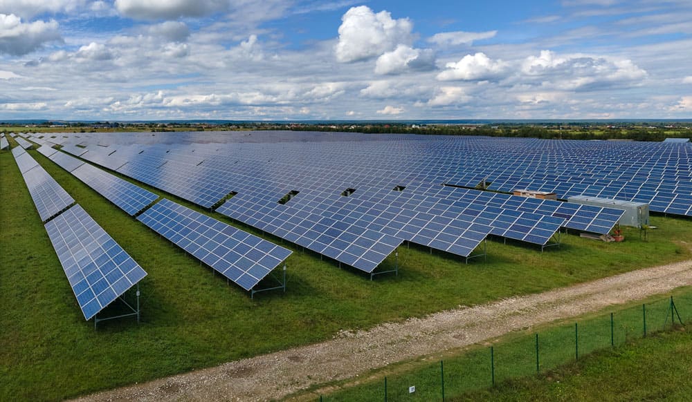 Ground-mounted solar panels in a field