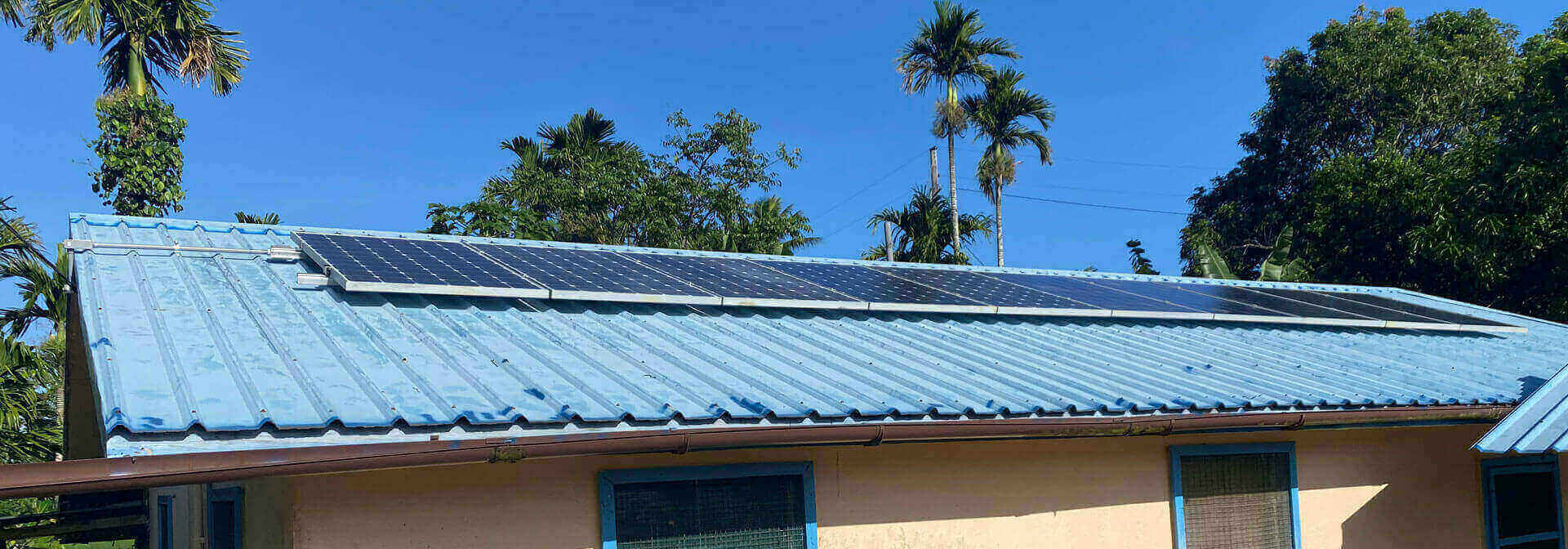 Solar panel array covering the roof of a family home